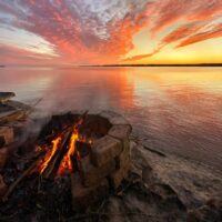 Campfire in a ring during sunset.