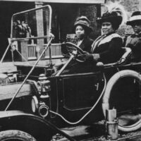 Madam C.J. Walker drives three friends in an early automobile, 1911.