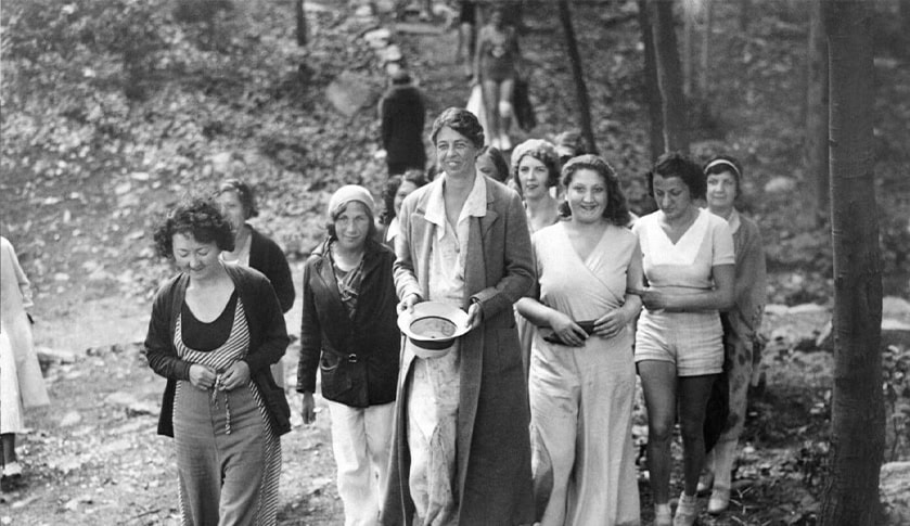 Eleanor Roosevelt walking outside with a group of women