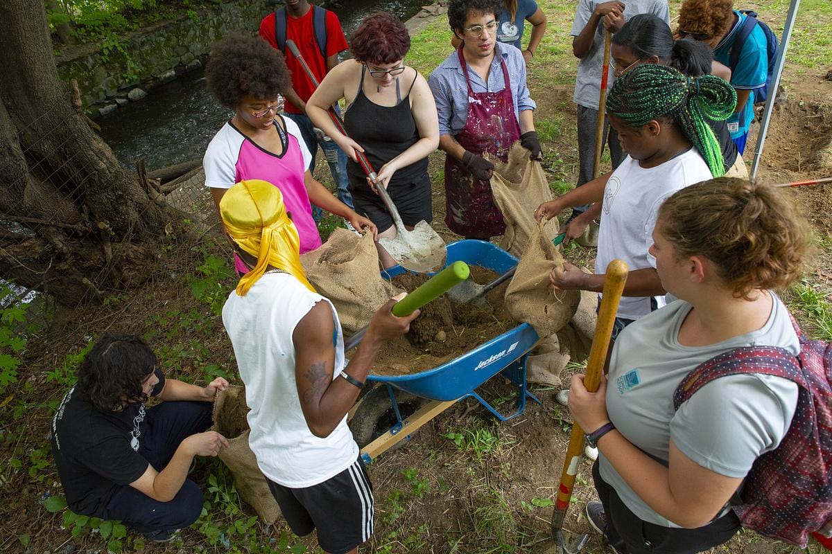 Art Effect Students clean land beside the Fall Kill Creek to create an art installation in the city of Poughkeepsie